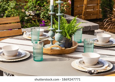 Outdoor Patio Detail: Table With Place Setting And Centerpiece Outside New Home