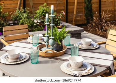 Outdoor Patio Detail: Table With Place Setting And Centerpiece Outside New Home