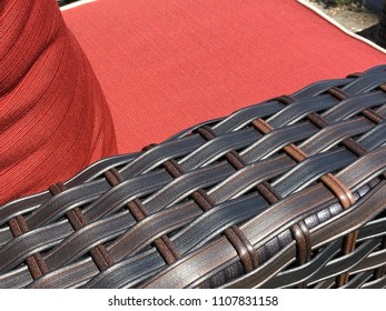 Outdoor Patio Furniture Wicker Pattern Texture With Red Cushions For A Fancy Backyard Setting On A Perfect Sunny Summer Day Relaxing At Home Close Up On Texture