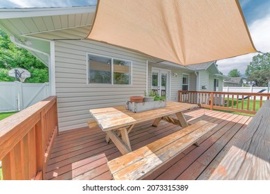 Outdoor Patio On A Deck Of A House With Shade Sail