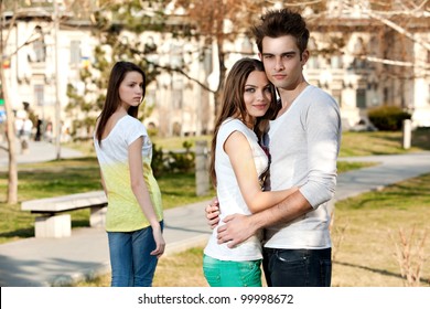 Outdoor Photo Of A Young Woman Jealous On A Happy Couple