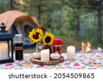 Outdoor picnic table styled for fall at a campsite