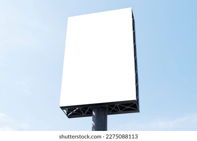 Outdoor pole billboard on blue sky background with mock up white screen and clipping path