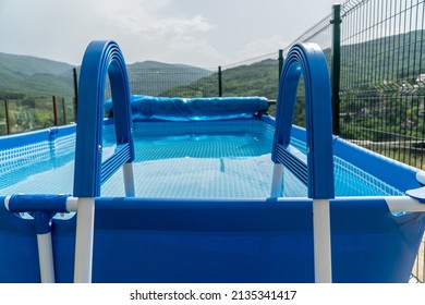 Outdoor portable pool with amazing view to the mountains. First person view from a temporary pool.