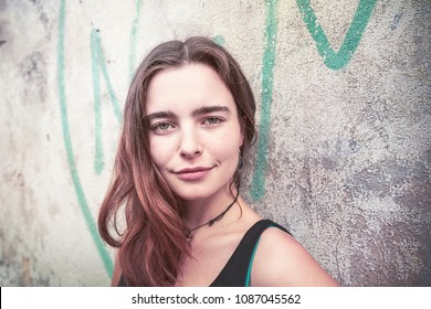 Outdoor Portait Of A Smiling Young Woman