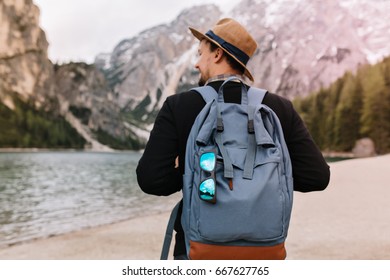 man carrying backpack