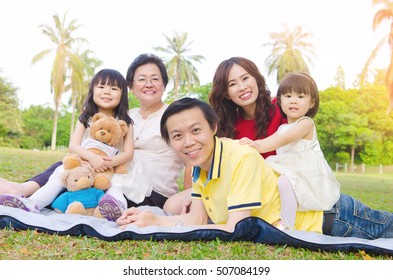 Outdoor portrait of a beautiful asian three generations family - Powered by Shutterstock