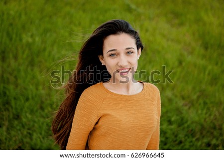 Outdoor portrait of beautiful happy teenager girl