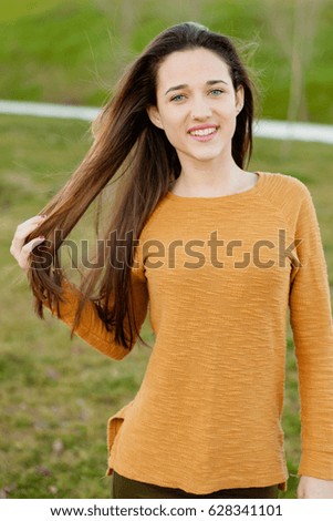 Similar – Outdoor portrait of beautiful happy teenager girl