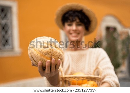 Outdoor portrait of beautiful woman with fruit
