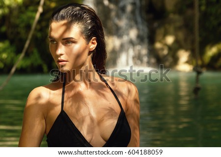 Outdoor portrait of  beautiful woman in jungles