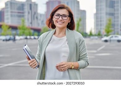 Outdoor Portrait Of Business Woman 40s Of Age