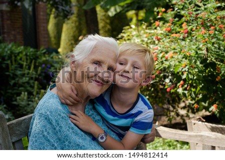 Grandma cuddles up with her grandson