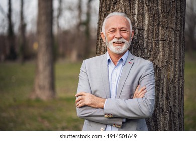 Outdoor Portrait Of Happy Senior Businessman.