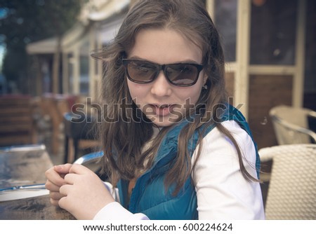Outdoor Portrait of a happy teenage girl. LOMO effect