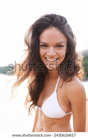 Outdoor, portrait or happy woman at a beach for travel adventure to relax on holiday vacation. Tourist, bikini or female person with fitness or smile in nature for fresh air, sea or ocean in Bali