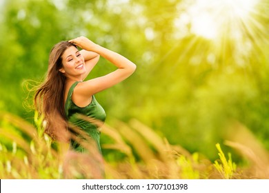 Outdoor Portrait of Happy Young Woman in Nature. Attractive Girl in Sunny Summer Green Park