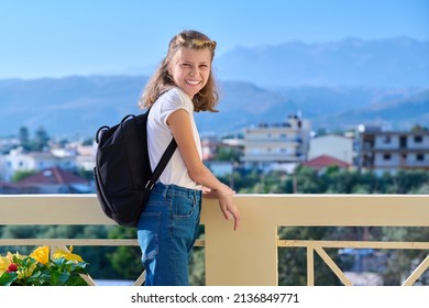 Outdoor Portrait Of A Little Student Girl 10, 11 Years Old