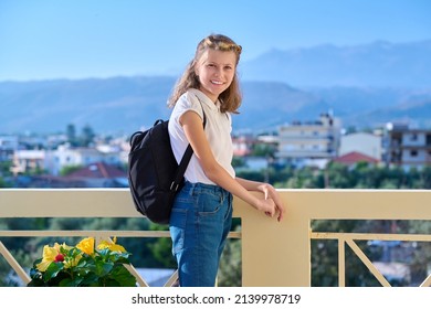 Outdoor Portrait Of A Little Student Girl 10, 11 Years Old