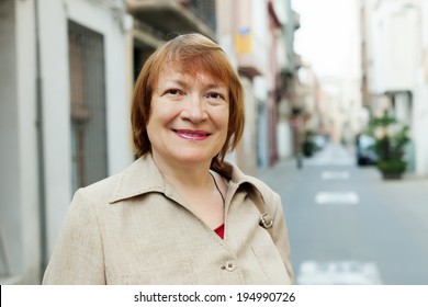 Outdoor  Portrait Of  Mature Woman At European Town Street