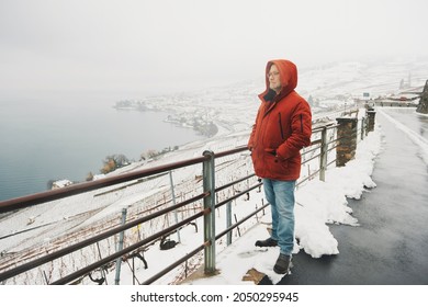 Outdoor portrait of middle age man enjoying winter landscape of snowy vinyards - Powered by Shutterstock