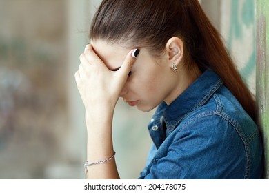 Outdoor portrait of a sad teenage girl looking thoughtful about troubles - Shutterstock ID 204178075