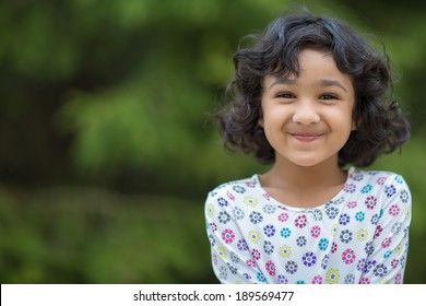 Outdoor Portrait of a Smiling Little Girl
