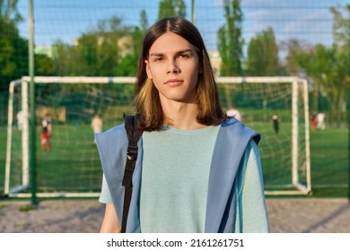 Outdoor Portrait Of Student Boy 17, 18 Years Old, In Sunset On School Football Field