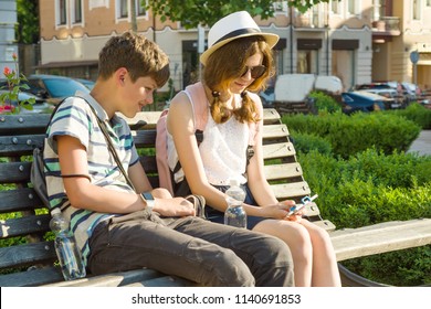 Outdoor Portrait Of A Teenage Boy And Girl 14, 15 Years Old