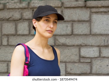 Outdoor Portrait Of Thoughtful Hispanic Woman In Her 30s.