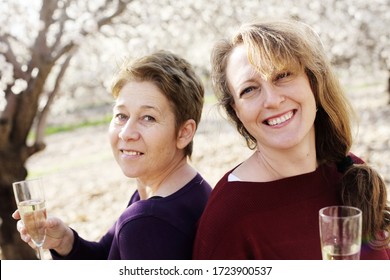 Outdoor Portrait Of Two Best Friends Women Celebrating The End Of Isolation