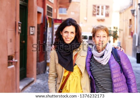 Similar – Image, Stock Photo two sisters laugh heartily on the street