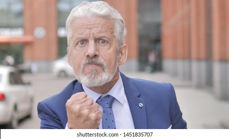 Outdoor Portrait of Yelling Angry Old Businessman