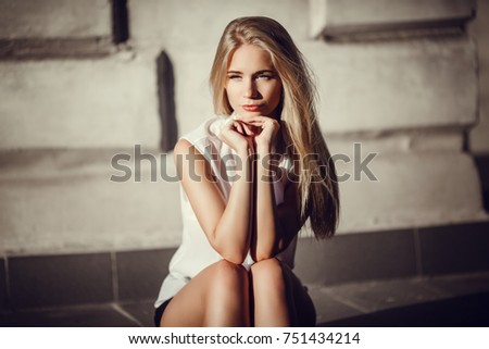 Similar – Image, Stock Photo Smiling young woman in urban background