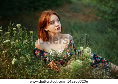 Similar – Young redhead woman surrounded by plants