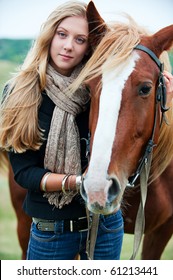 outdoor portrait of young beautiful woman with horse