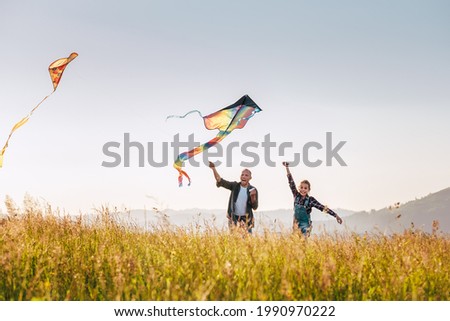 Similar – Vater und Sohn spielen im Park