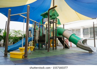 Outdoor Public Playground For Kids In Primary School Under The Shade