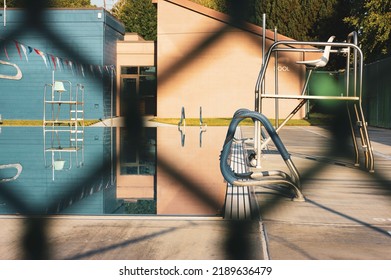 Outdoor Public Pool Seen From Behind Fence