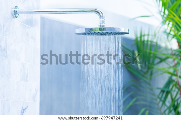 Outdoor rain shower in the beach for swimming\
pool.Saving water.Summer season.Rain shower.bathroom clean.Hygiene\
water saving.natural power energy.Sanitize.environment.water\
day.Ecology.Fresh\
image.