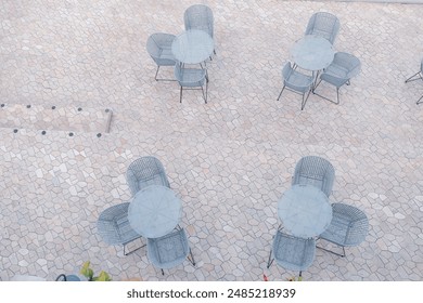 Outdoor restaurant coffee open air cafe chairs with table. Summer vacation on resort.view from the top - Powered by Shutterstock