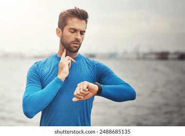 Outdoor, running and man with heart rate on smart watch for exercise, wellness and digital health stats at ocean. Technology, morning workout and runner with wristwatch to check pulse on fitness app - Powered by Shutterstock