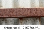 an outdoor rusty iron fench cause of weather