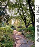 Outdoor Scene On Autumn Or Summer Day Shows Rock Garden Pathway In Lafayette Park, St Louis, Missouri. Trees, Plants, Flowers, Green Foliage In Background. Might Be Sunrise Or Sunset