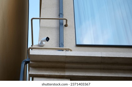 Outdoor security camera. Security camera on the facade of the building