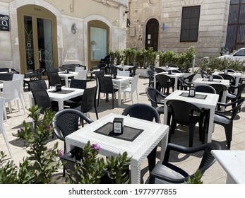 Outdoor Set Tables Of A Puglia Restaurant. Molfetta, Puglia, Italy - 22.05.2021