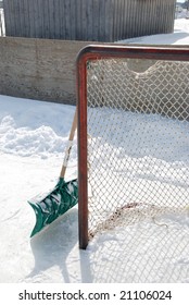 Outdoor Shinny Hockey Net And Snow Shovel To Clear The Ice