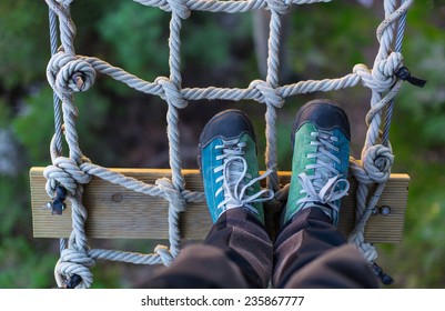 Outdoor Shoes On A Rope Grid , In An Adventure Park