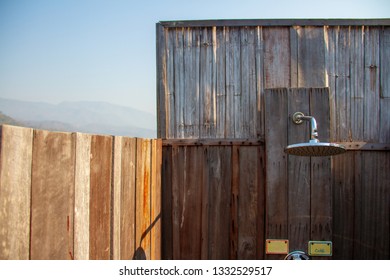 Outdoor Shower With A Large Shower In The Bathroom Made From Wooden Wall For Tourists To Steep A Shower After The Tour.