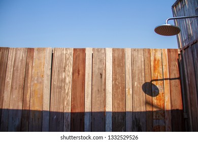 Outdoor Shower With A Large Shower In The Bathroom Made From Wooden Wall For Tourists To Steep A Shower After The Tour.